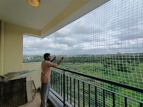 Close-up view of a completed balcony safety net installation