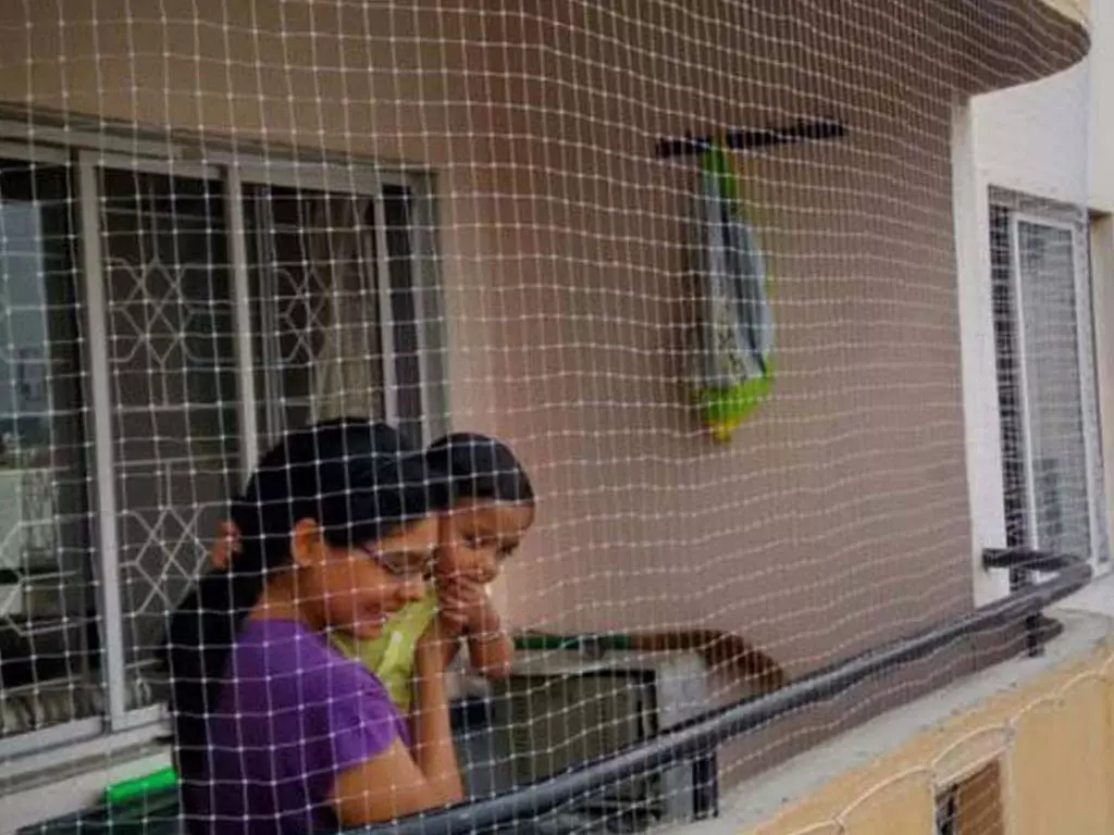 Close-up of a worn balcony safety net showing signs of wear in Hyderabad