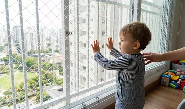Completed children's safety net protecting a balcony for kids